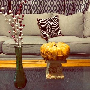 Orange/ black and white decorative pillow.